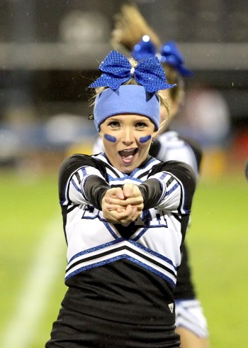 A cheerleader during a game.